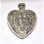 A Silver Heart Shaped Perfume Bottle