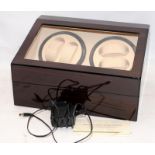 Automatic watch winder with 4 winding heads and storage space for an additional 6 watches.