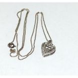 Silver and diamond ladies necklace pendant the heart shape swing set with a round cut diamond