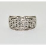 A Four row diamond and 9ct gold ring, Size o