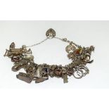 Good silver charm bracelet and charms approx 25, 80g