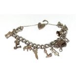 Silver charm bracelet and charms (10) 53g