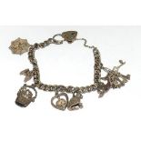 Silver charm bracelet and assorted charms (6)