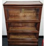 Globe Wernicke mahogany three section barrister's bookcase with three sections above a drawer.
