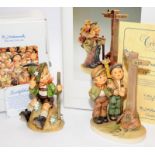 Two Goebel Hummel figures 'Alpine Mountaineer' and 'Crossroads'. Both boxed with certificates.