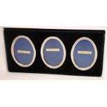 Set of three small oval Sterling silver easel backed picture frames, boxed. 7cms along longest side