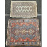 Two vintage hand knotted carpets both require a clean.