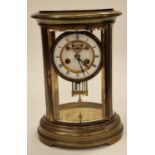 Antique quality oval four glass striking clock with mercury pendulum and key. Ticks when wound.