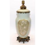 Large Oriental relief design china and gilded metal table lamp standing on a gilt pierced base