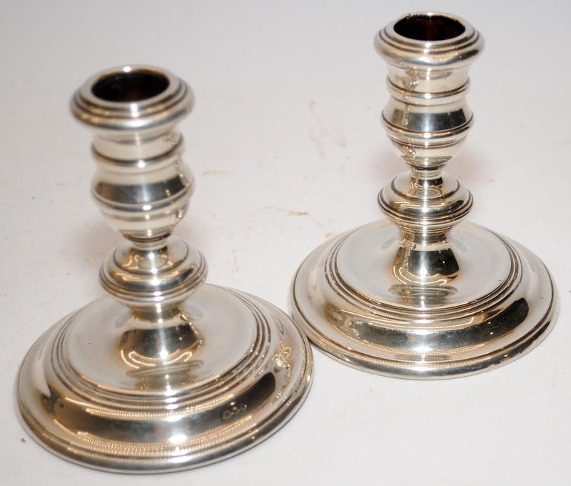 A pair of squat silver candlesticks with weighted bases and worn hallmarks together with a - Image 4 of 6