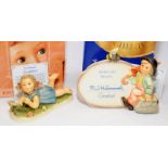 Two Goebel Hummel figures 'Miss Beehaving' and 'Plaque-Merry wanderer With Bumble Bee'. Both boxed
