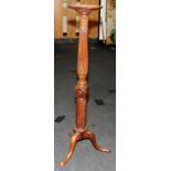 Mahogany Torchiere on triple supports and spade feet with a twist centre and carved upper topped