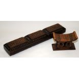 African carved wood hinged storage box together with a neck rest/pillow