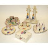 A collection of Poole Pottery table accompaniments including condiments sets, butter dish, egg