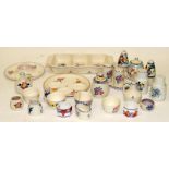 A collection of Poole Pottery table accompaniments including condiments sets, egg cups, napkin rings