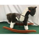 Small child’s wooden rocking horse.