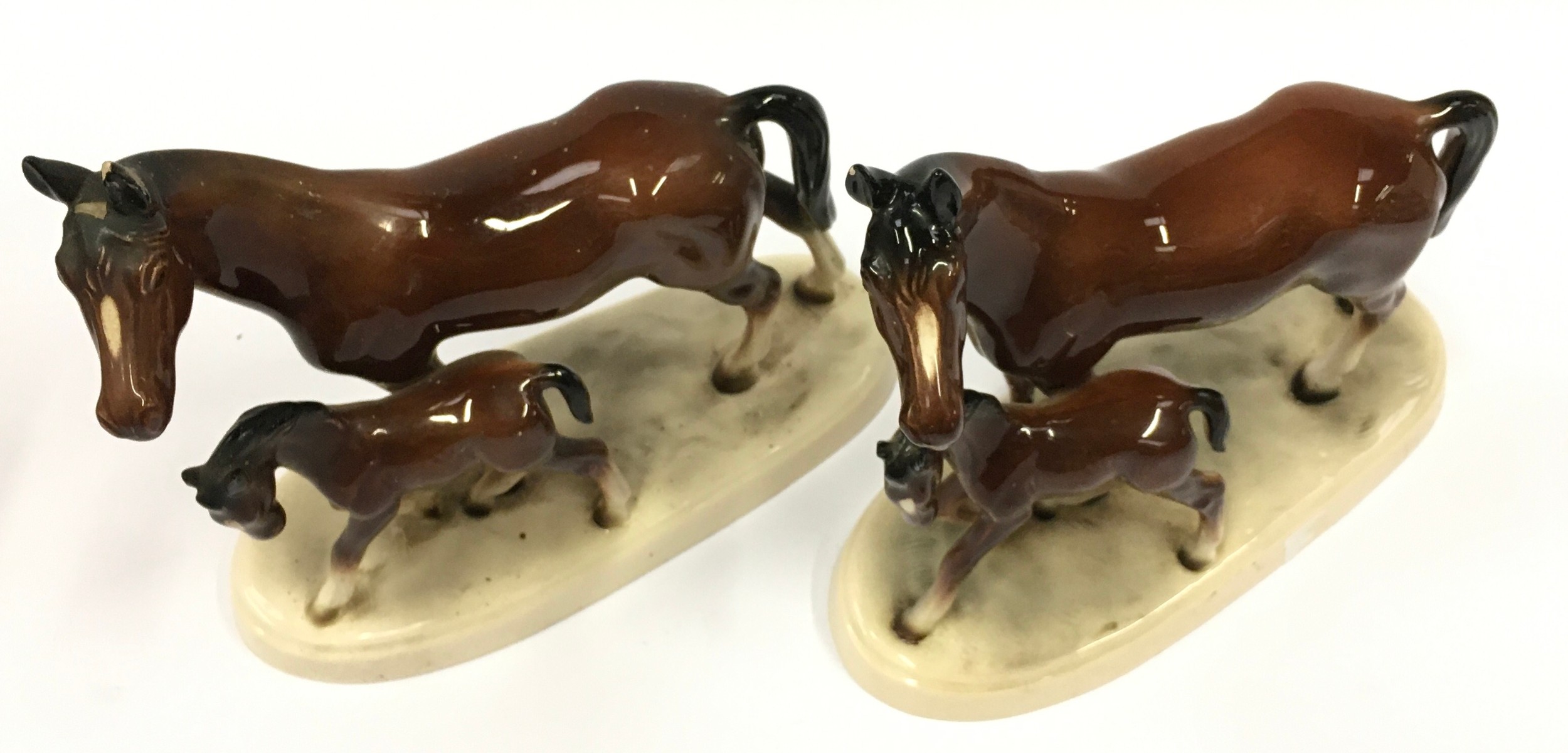 A pair of ceramic horse and foal figurines with marks to bases each measuring 19cm tall. - Image 2 of 3