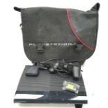 A PlayStation 3 bag that contains a PlayStation 3 along with wires and a controller