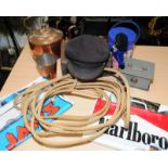 Carton of collectibles to include a lasso, metalware and a collectible Jaws carrier bag