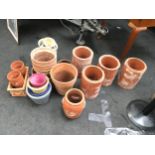 Large Quantity of terracota and other garden pots to include a strawberry pot.