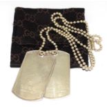 Genuine hallmarked Gucci dog tags with bag.