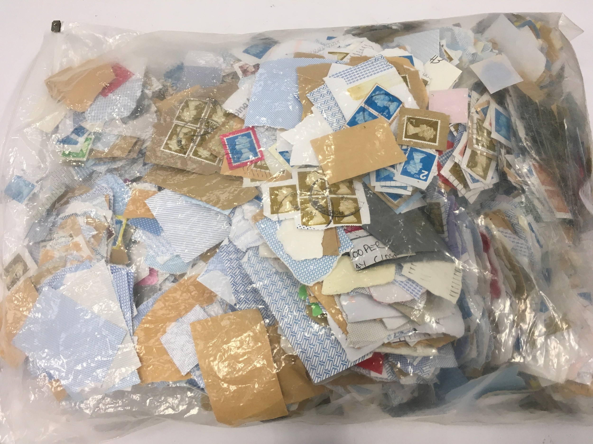 Bag of loose stamps to sort.