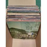 Box of various vinyl LP records.