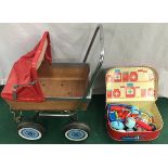 Child’s pram along with a toy doctors and nurses play kit.