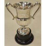 Silver hallmarked twin handled trophy cup with local Poole engraving presented 1934. Hallmarked