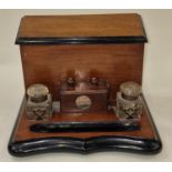 Mahogany desk tidy with inkwells and revolving calendar