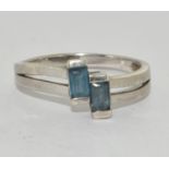 A 925 silver and blue stone ring Size T