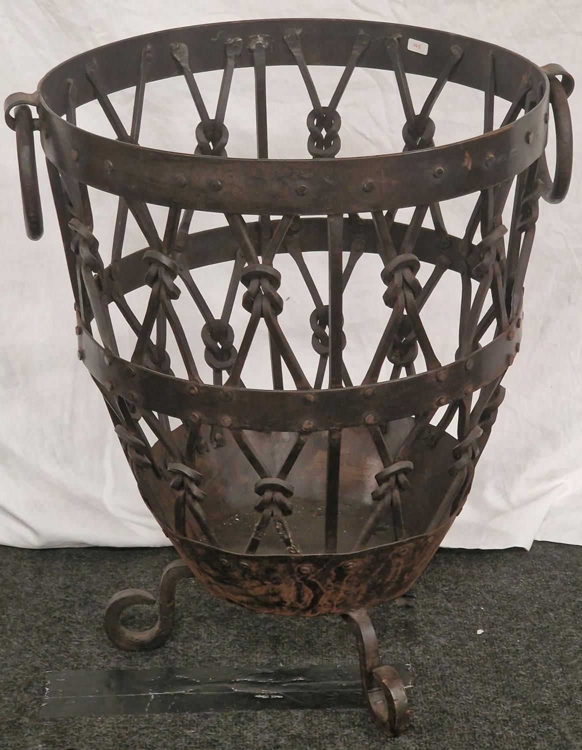 A Wrought log basket. (195)