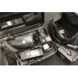 Two vintage camcorders. A Panasonic MC20 and a Panasonic G2 movie camera. Both cased with some