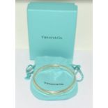 Tiffany & Co fully hallmarked silver bangle, boxed.