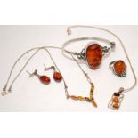 A collection of silver and amber jewellery