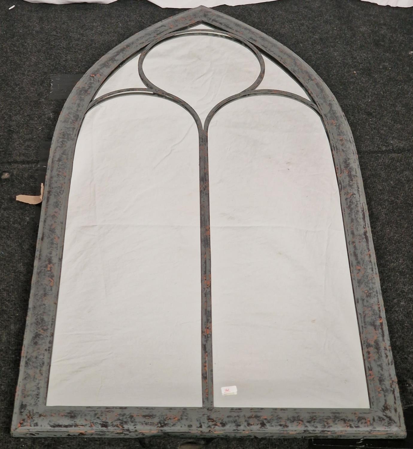 A Wide arched outdoor mirror. (161)