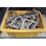 Small crate of vintage cast shackles average size 15cm.