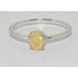 An opal solitaire silver ring Size U