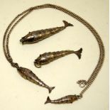 4 x vintage articulated fish pendants with ruby eyes, two of which are attached to a 28" silver