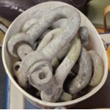 Tub of vintage cast shackles average size 20cm.