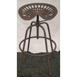 A tractor seat stool (133)