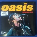 OASIS “KNEBWORTH” TRIPLE VINYL LP SET. Triple Heavyweight Vinyl LP in Deluxe Trifold Sleeve And