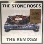 THE STONE ROSES ‘THE REMIXES’ LIMITED EDITION CLEAR + RED SWIRL DOUBLE VINYL. Found here in