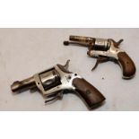 A pair of antique miniature revolvers. For display purposes only.