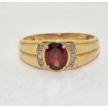 A Garnet/Diamond 2.7g 10ct gold ring Size W