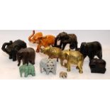 A collection of vintage elephants, wood, soapstone, brass etc