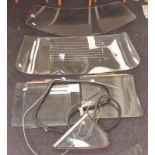 Collection of vintage windscreens, side mirrors and windows. Vendor advises these may have come from