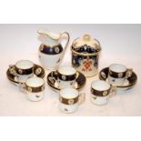 Set of 6 Copeland coffee cans and a jug By T Goode & Co decorated with Birds of Paradise c/w a