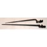 Two antique military socket spike bayonets. Largest is 50.5cms long. One bears a serial number and