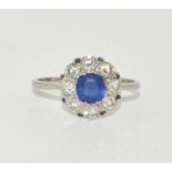 An 18ct white gold Sapphire/Diamond daisy ring Possibly French, Size S. Boxed.